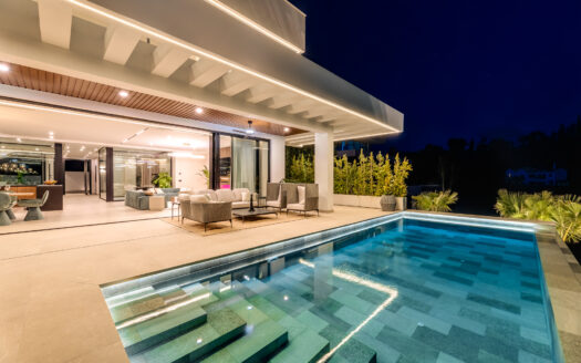 Is an exclusive new development located in the heart of Madroñal, Benahavís.This exceptional project comprises two identical contemporary villas, both offering breathtaking panoramic sea views and set within a prestigious gated community with 24-hour security.This villa spans three levels and is designed to provide the ultimate in luxury living.The lower floor features a private spa with the latest micro-cementation technology, including a heated indoor pool, Finnish sauna, and Turkish bath.Additionally, residents will enjoy a fully equipped gym, a games room with a pool table, a bar, and a spacious wine cellar.The architectural concept revolves around two elegant glass cubes, which create an internal courtyard where a beautiful olive tree takes center stage an ideal setting for relaxing or enjoying shisha. Floor-to-ceiling windows flood the interiors with natural light while incorporating sun protection for a comfortable atmosphere year-round.The outdoor area offers an expansive terrace with panoramic sea views and an infinity pool made from Indonesian stone, renowned for its water-purifying properties. Sunbeds, a large dining table, and a stylish chill-out zone complete this perfect Mediterranean retreat.The master suite is thoughtfully designed with two en-suite bathrooms and two separate dressing areas, maximizing both comfort and privacy. A staff room and a dedicated laundry area further enhance functionality.Technology and entertainment are state-of-the-art, with the latest OLED TV featuring Acoustic Surface Audio and a BOSE sound system integrated with artificial intelligence.Each villa also includes a private garage with space for four vehicles. In the near future, a new road will connect Madroñal directly with Real de la Quinta and Nueva Andalucía, improving access and convenience.Offers an extraordinary living experience where striking modern design, top-tier amenities, and stunning sea views come together in perfect harmony.